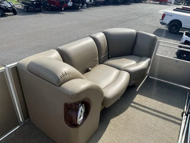 Slide: The Image of Luxurious seating on a 2015 Godfrey 2500 FE BAR pontoon boat, featuring plush leather upholstery. - 10