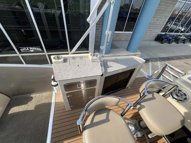 Slide: The Image of 2015 Godfrey 2500 FE BAR boat with bar seating and countertop. - 19
