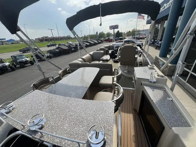 Slide: The Image of 2015 Godfrey 2500 FE BAR pontoon boat with seating, bar area, and canopy. - 22