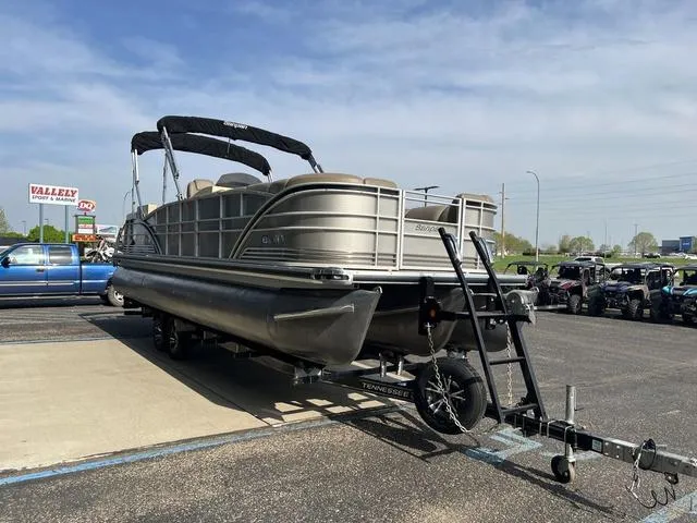 Slide: The Image of 2015 Godfrey 2500 FE BAR pontoon boat on trailer in parking lot. - 5
