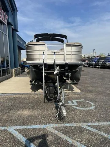 Slide: The Image of 2015 Godfrey 2500 FE BAR pontoon boat on trailer in parking lot. - 6