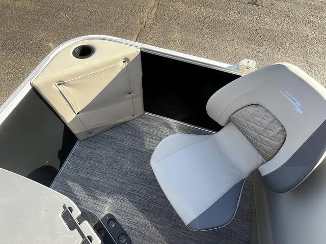 Slide: The Image of 2025 Bennington 22SF Tri-Toon Pontoon interior with gray seating and flooring. - 12