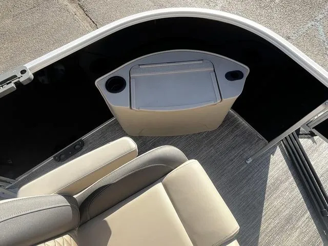 Slide: The Image of 2025 Bennington 22SF Tri-Toon Pontoon interior with seating and storage compartment. - 15