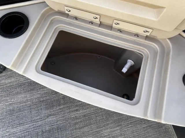 Slide: The Image of Storage compartment on 2025 Bennington 22SF Tri-Toon Pontoon boat with cup holders. - 16