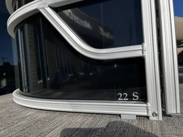 Slide: The Image of 2025 Bennington 22SF Tri-Toon Pontoon, close-up of sleek window design. - 3