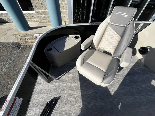 Slide: The Image of 2025 Bennington 22SF Tri-Toon Pontoon with gray seating and storage compartment. - 6