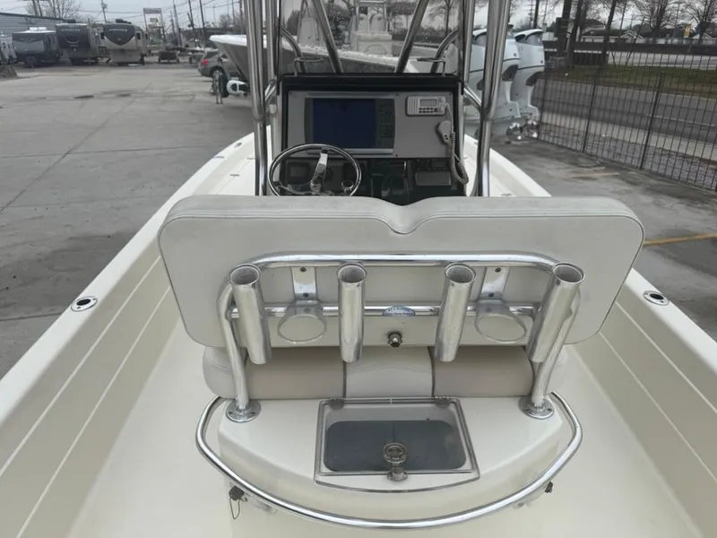 Slide: The Image of 2012 ShearWater 25LTZ boat interior with console and rod holders. - 10