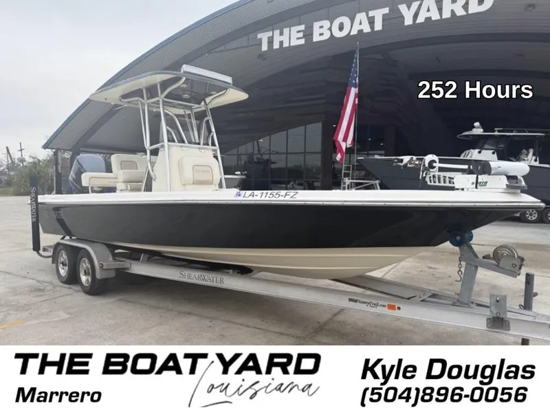 Slide: The Image of 2012 ShearWater 25LTZ boat on trailer at The Boat Yard, 252 hours, Marrero, Louisiana. - 2