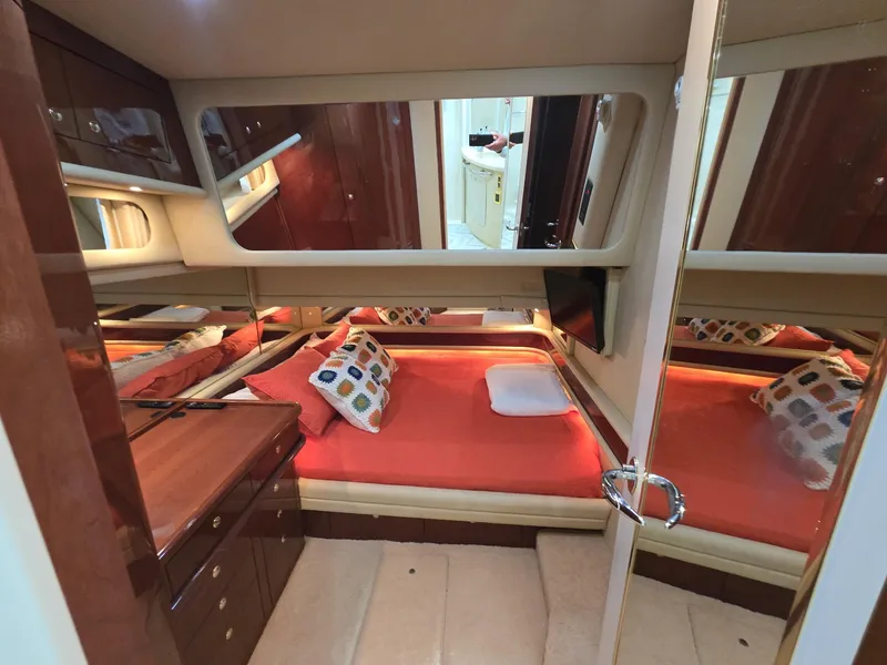 Slide: The Image of Luxurious cabin interior of 2002 Sea Ray 560 Sedan Bridge yacht with cozy bedding. - 15