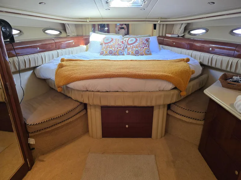 Slide: The Image of Luxurious bedroom interior of 2002 Sea Ray 560 Sedan Bridge yacht. - 19