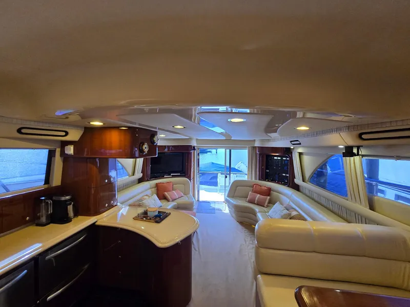 Slide: The Image of Luxurious interior of a 2002 Sea Ray 560 Sedan Bridge yacht with elegant seating and modern amenities. - 27