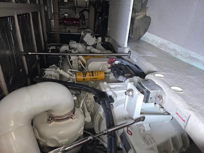 Slide: The Image of Engine room of 2002 Sea Ray 560 Sedan Bridge with visible mechanical components. - 30