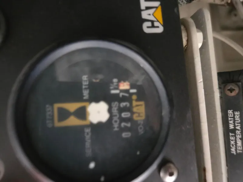 Slide: The Image of Hour meter on a 2002 Sea Ray 560 Sedan Bridge, showing 2037 hours. - 33