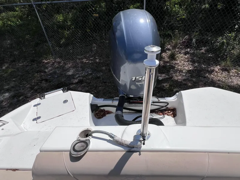 Slide: The Image of 2017 NauticStar 203SC Sport Deck boat with outboard motor and deck details. - 11