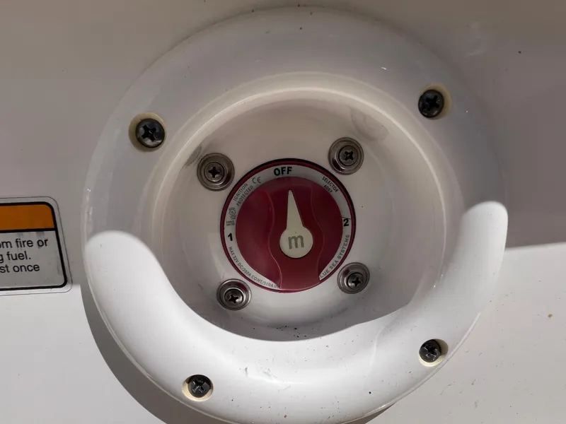 Slide: The Image of Battery switch on a 2017 NauticStar 203SC Sport Deck boat. - 13