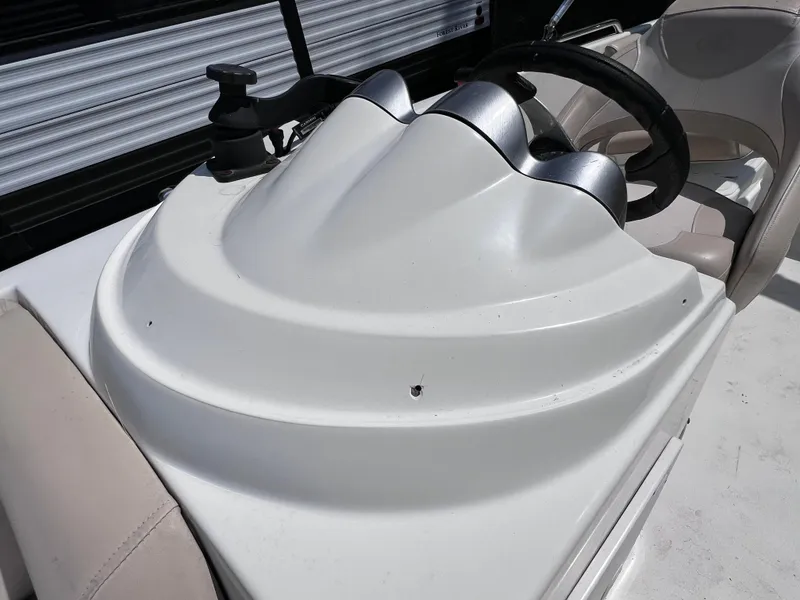 Slide: The Image of 2017 NauticStar 203SC Sport Deck boat dashboard with steering wheel and controls. - 26