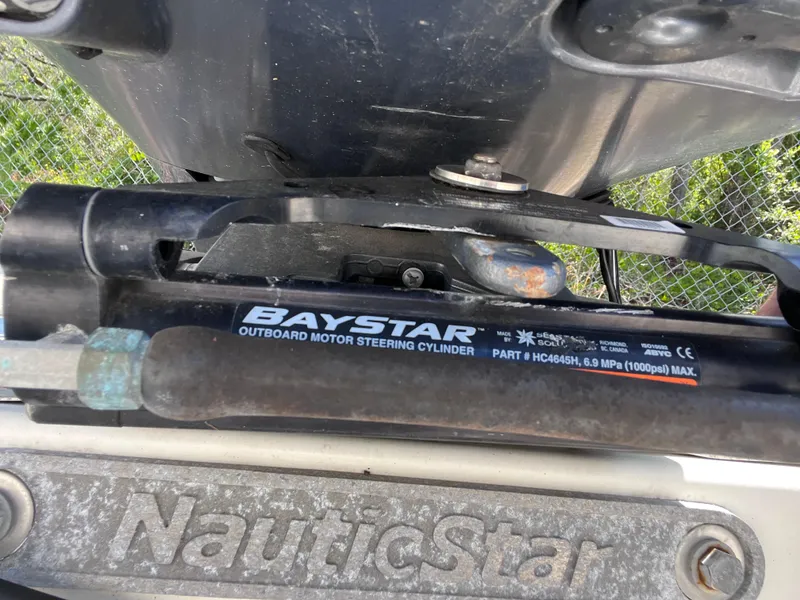 Slide: The Image of BayStar outboard motor steering cylinder on 2017 NauticStar 203SC Sport Deck boat. - 27