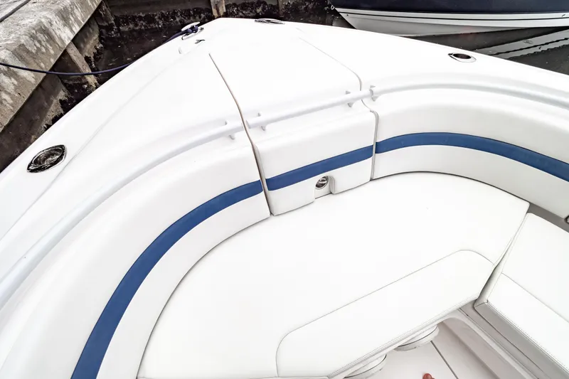 Slide: The Image of 2018 Intrepid 327 Center Console boat with white and blue seating detail. - 13