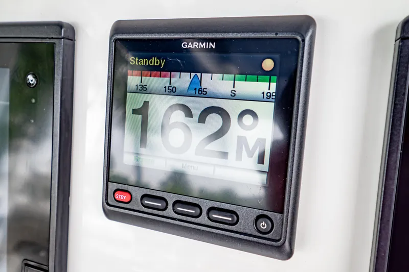 Slide: The Image of Garmin display on 2018 Intrepid 327 Center Console showing 162° heading. - 25