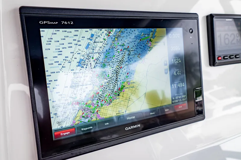 Slide: The Image of Garmin GPSMAP 7612 on 2018 Intrepid 327 Center Console boat, displaying nautical chart. - 26