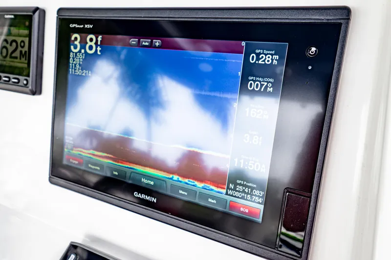 Slide: The Image of Garmin GPS display on 2018 Intrepid 327 Center Console boat dashboard. - 28