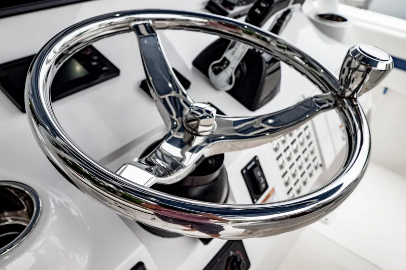 Slide: The Image of Chrome steering wheel of a 2018 Intrepid 327 Center Console boat. - 29