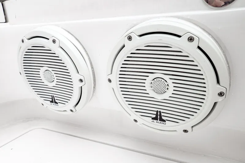 Slide: The Image of White JL Audio speakers on a 2018 Intrepid 327 Center Console boat. - 37