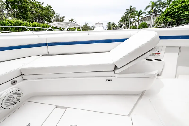 Slide: The Image of 2018 Intrepid 327 Center Console boat interior with white seating and blue accents. - 38