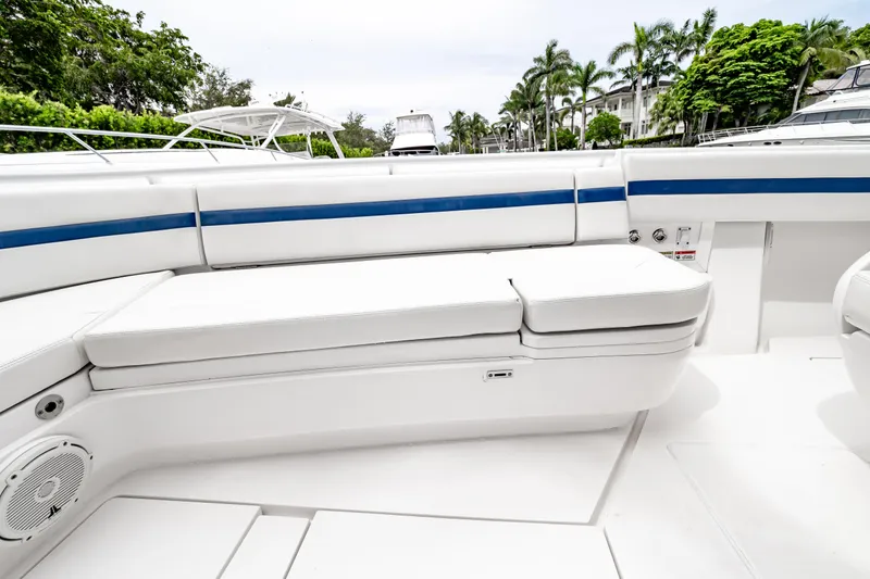 Slide: The Image of 2018 Intrepid 327 Center Console boat with white seating and blue accents. - 39