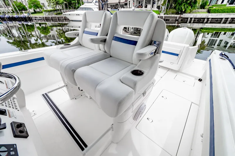 Slide: The Image of 2018 Intrepid 327 Center Console boat with luxurious seating and sleek design. - 4