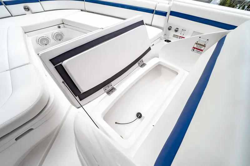 Slide: The Image of 2018 Intrepid 327 Center Console boat interior with open storage compartment. - 40