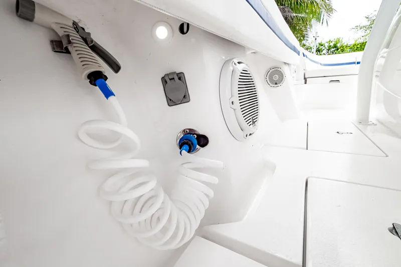 Slide: The Image of 2018 Intrepid 327 Center Console boat interior with hose and speaker system. - 42