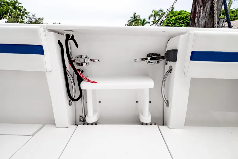 Slide: The Image of 2018 Intrepid 327 Center Console boat interior with seating and storage features. - 43