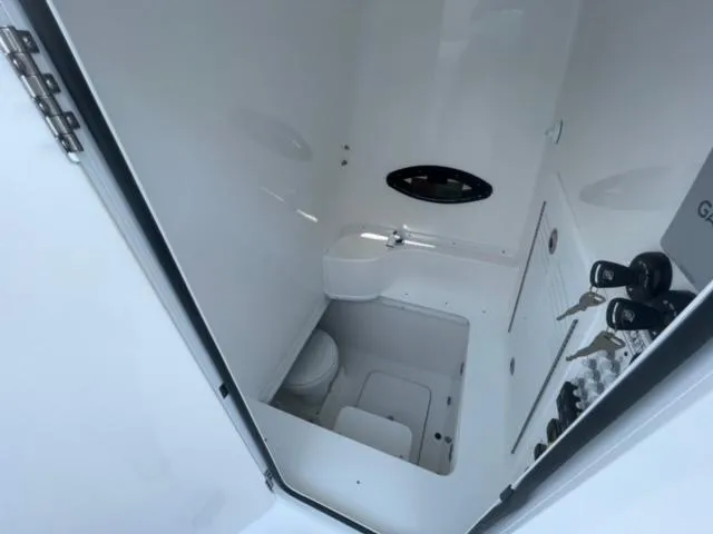 Slide: The Image of Interior of 2025 Contender 35 ST boat bathroom with compact design and modern fixtures. - 14