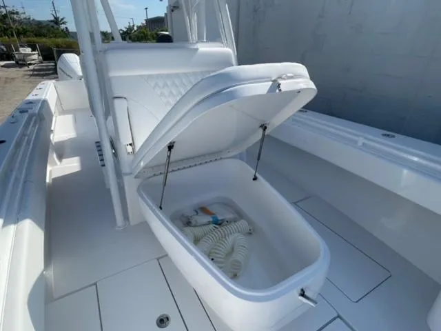Slide: The Image of 2025 Contender 35 ST boat with open storage compartment on deck. - 22