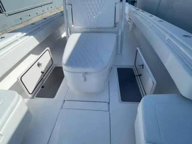 Slide: The Image of 2025 Contender 35 ST boat interior with storage compartments and seating. - 23