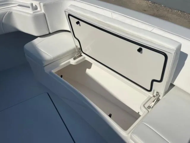 Slide: The Image of 2025 Contender 35 ST boat storage compartment with open lid, showcasing spacious interior. - 29