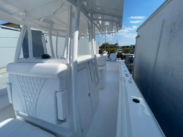 Slide: The Image of 2025 Contender 35 ST boat with sleek white interior and spacious deck. - 32