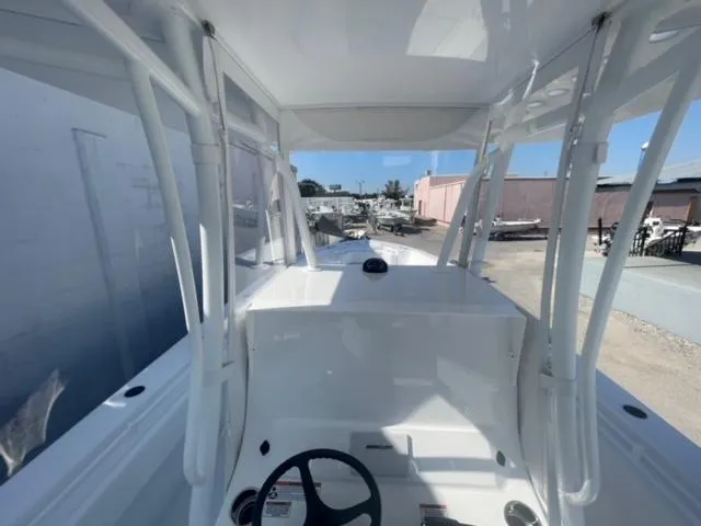 Slide: The Image of 2025 Contender 35 ST boat interior, featuring helm and seating area. - 34