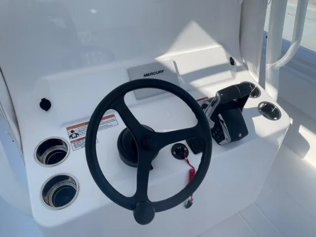 Slide: The Image of Steering console of 2025 Contender 35 ST boat with Mercury controls. - 35