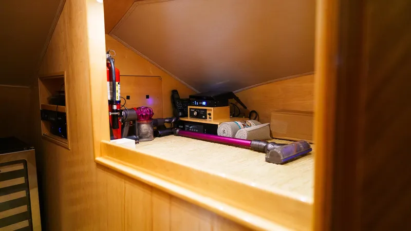 Slide: The Image of Interior storage area of 2012 Viking 70 Enclosed Bridge yacht with cleaning equipment. - 19