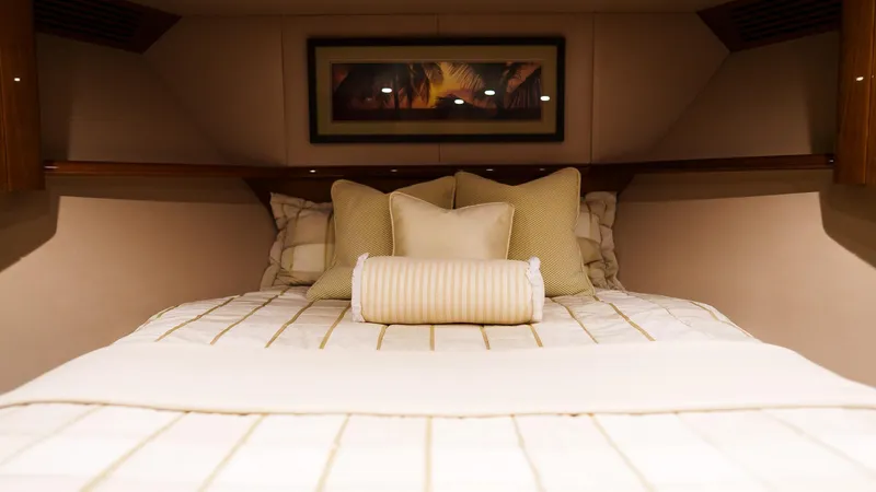 Slide: The Image of Luxurious bedroom interior of 2012 Viking 70 Enclosed Bridge yacht with elegant bedding. - 24