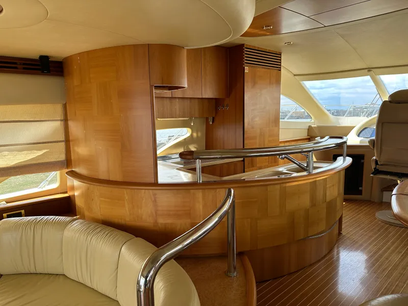 Slide: The Image of Luxurious interior of a 2008 Azimut 62 Evolution yacht with elegant wood finishes. - 16
