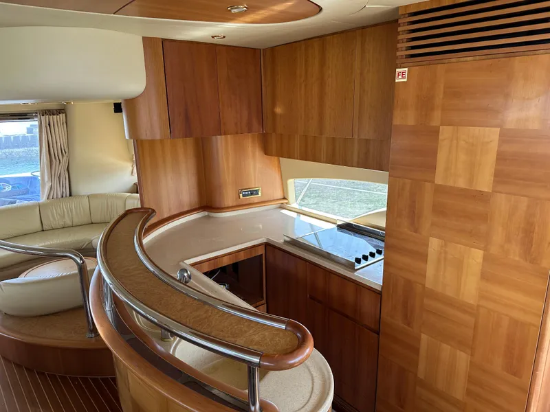 Slide: The Image of Luxurious interior of a 2008 Azimut 62 Evolution yacht with elegant wood finishes. - 17