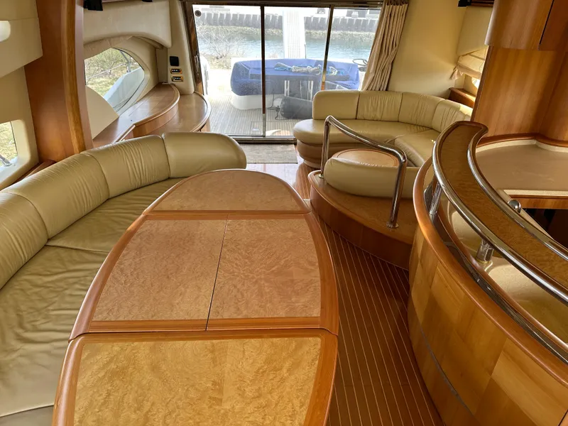Slide: The Image of Luxurious interior of a 2008 Azimut 62 Evolution yacht with elegant seating and wood finishes. - 18