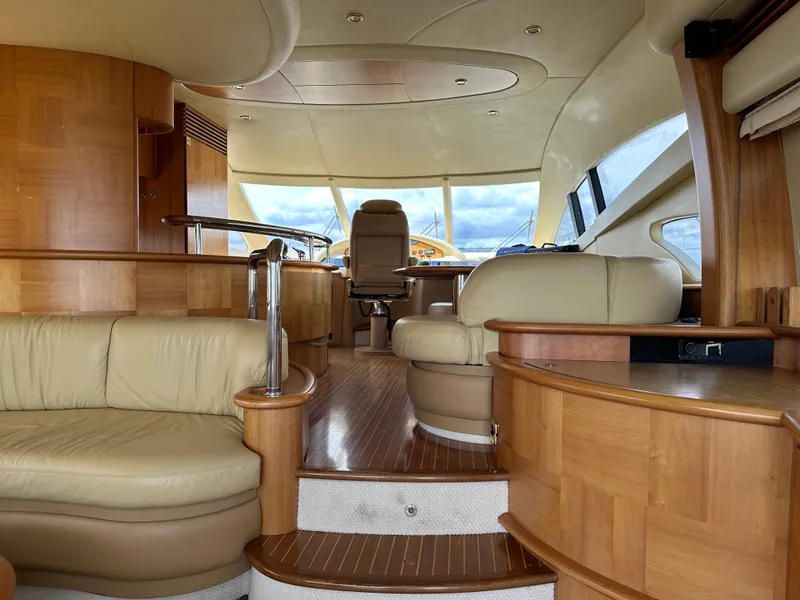 Slide: The Image of Luxurious interior of a 2008 Azimut 62 Evolution yacht with elegant wood and leather finishes. - 22