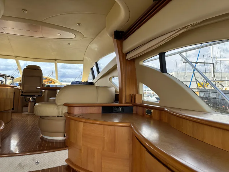 Slide: The Image of Luxurious interior of 2008 Azimut 62 Evolution yacht with elegant wood finishes and seating. - 23
