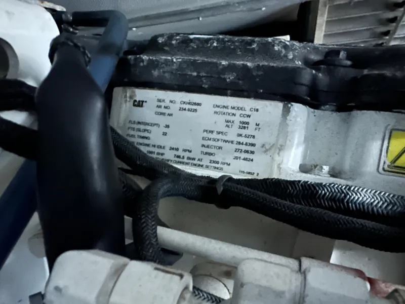 Slide: The Image of Engine compartment of a 2008 Azimut 62 Evolution yacht, featuring CAT engine details. - 28