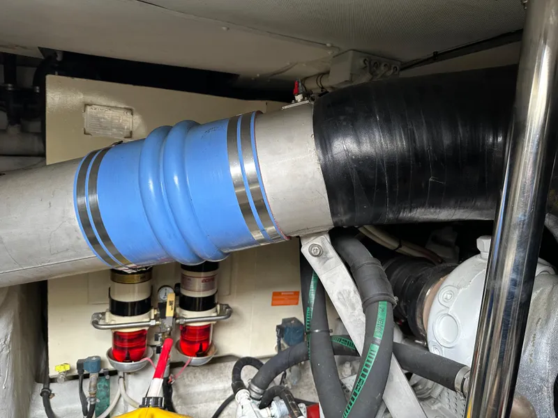 Slide: The Image of Engine room of 2008 Azimut 62 Evolution yacht, featuring hoses and mechanical components. - 33