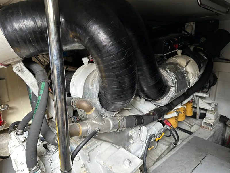 Slide: The Image of Engine compartment of a 2008 Azimut 62 Evolution yacht, showcasing intricate mechanical components. - 34